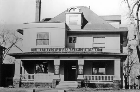 Black and white shot of two story house with 